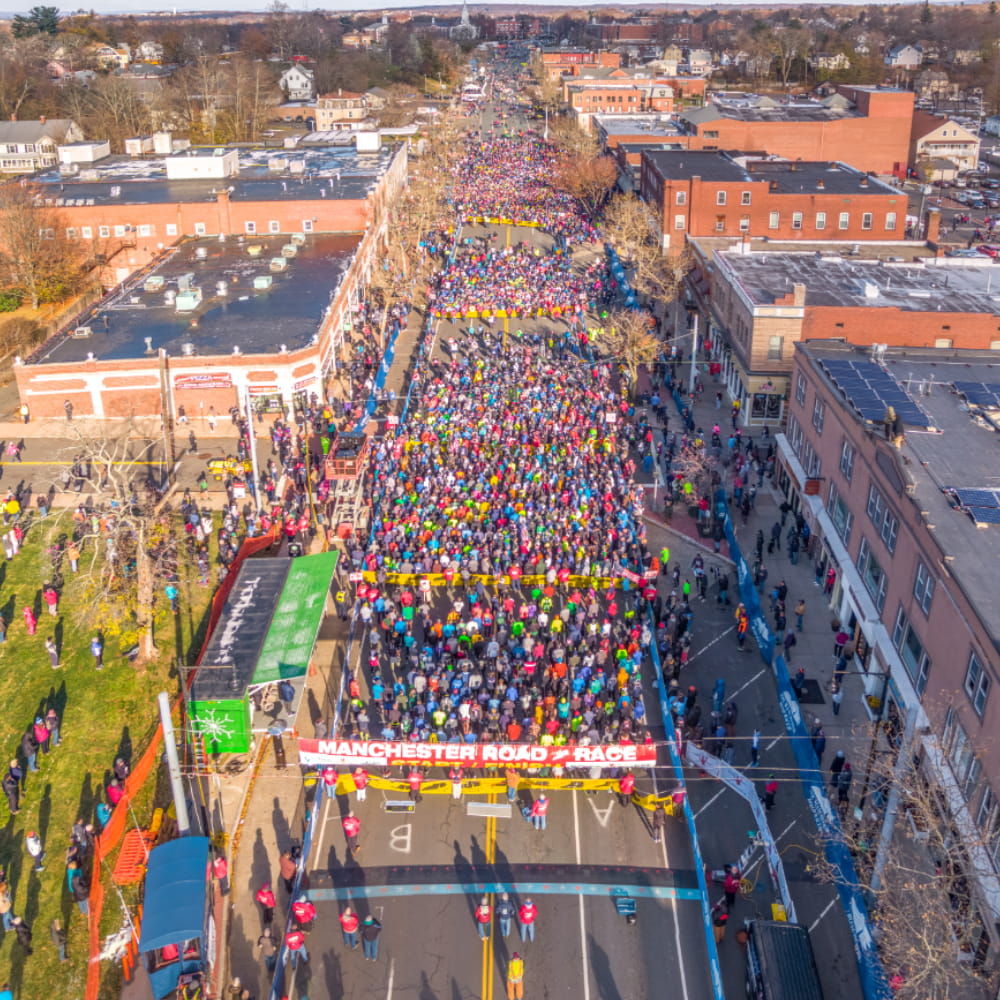 Aerial footage pedestrian road race event